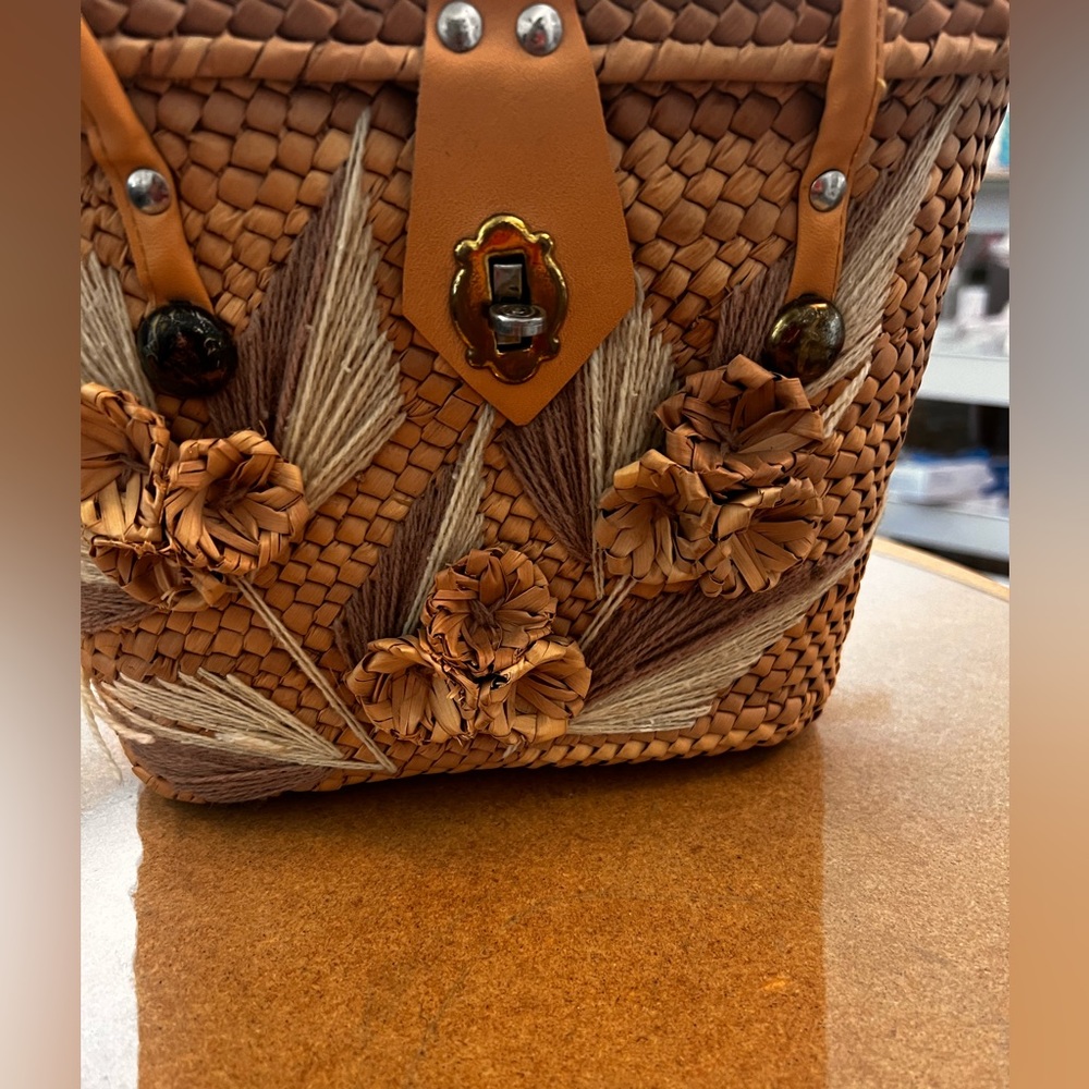 25% off of listed price. Small vintage straw bag. Two handle strap. Lock closure
